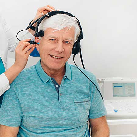 Man getting an auditory test in a hearing clinic
